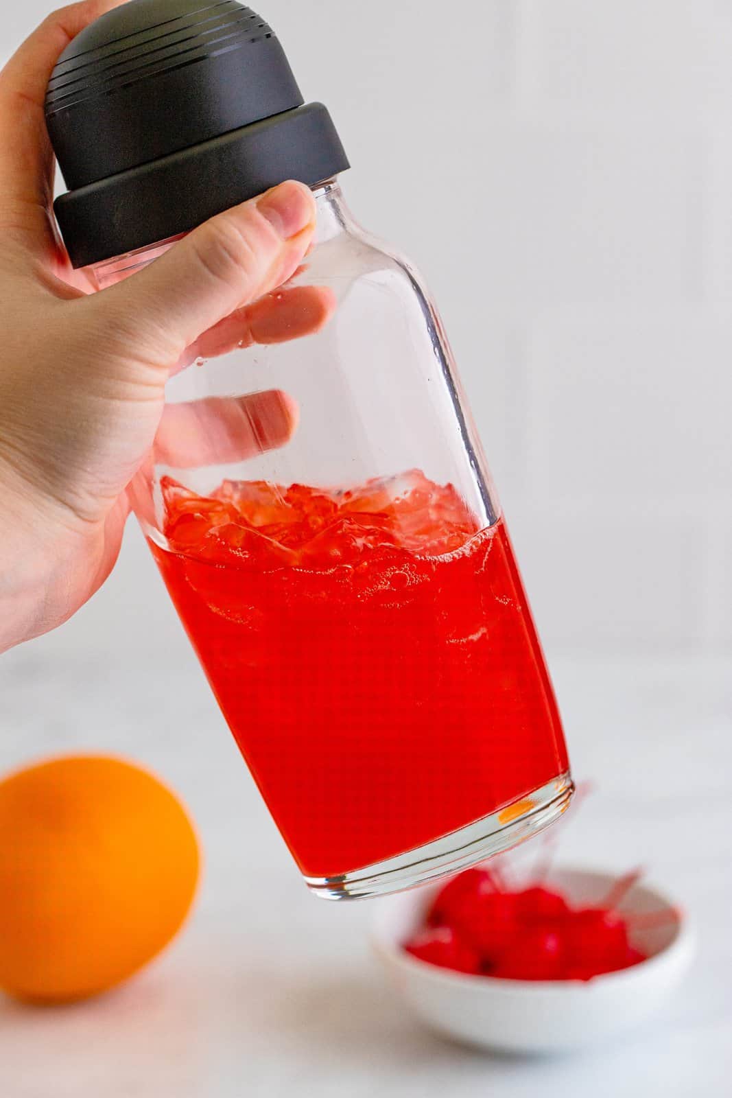 Cocktail shaker shaking the drink together.