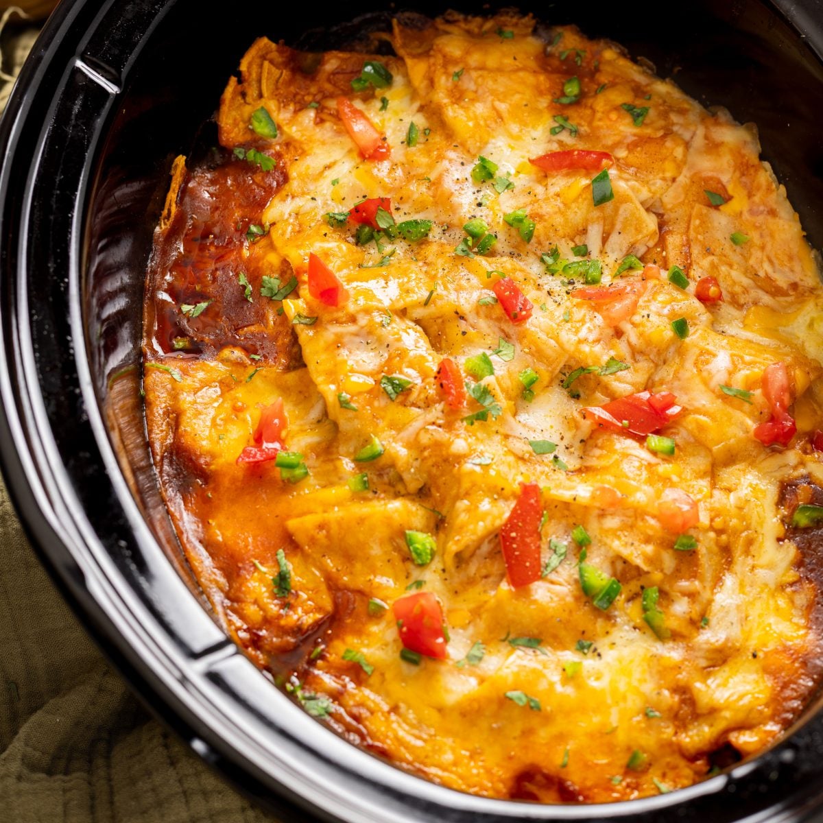 Looking down on a Crock Pot full of Enchilada Casserole.
