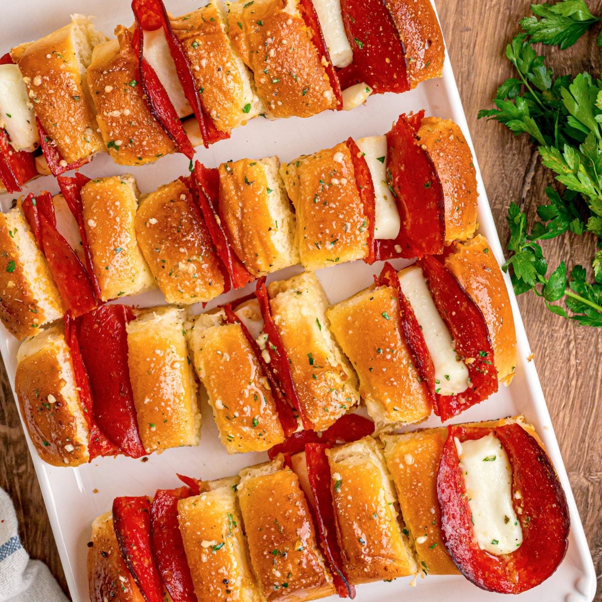 Closely looking down on a bunch of Pepperoni Pizza Hawaiian Rolls.